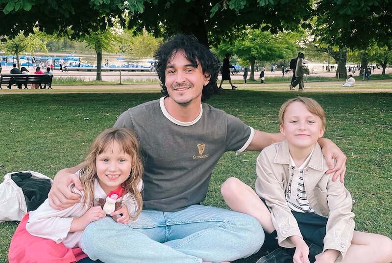 Scott Stewart with his two kids in the park